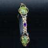 Heirloom amethyst and green jewellery redesign bracelet on stand