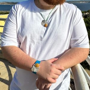 Stalactite-curved pendant and bracelet worn by man