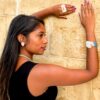 Stalactite-ring bracelet and stud earrings worn by woman